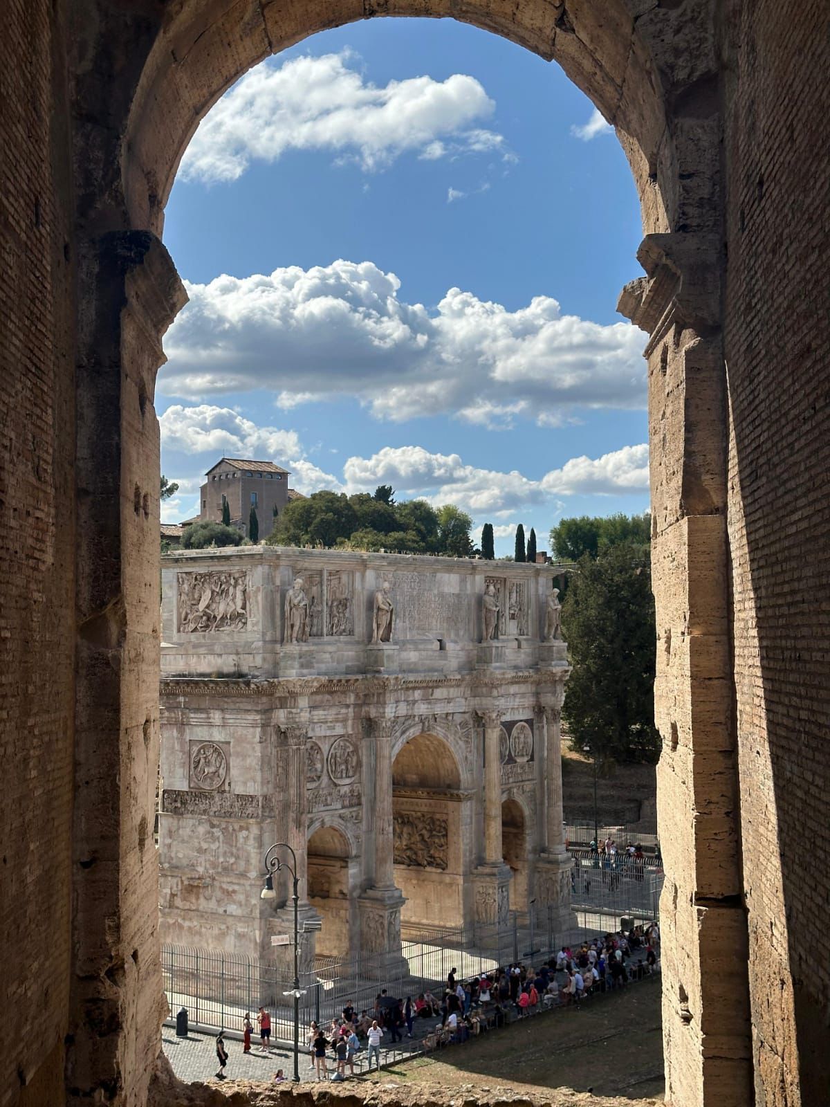 The Arch of Constantine framed by an arch of the Colosseum