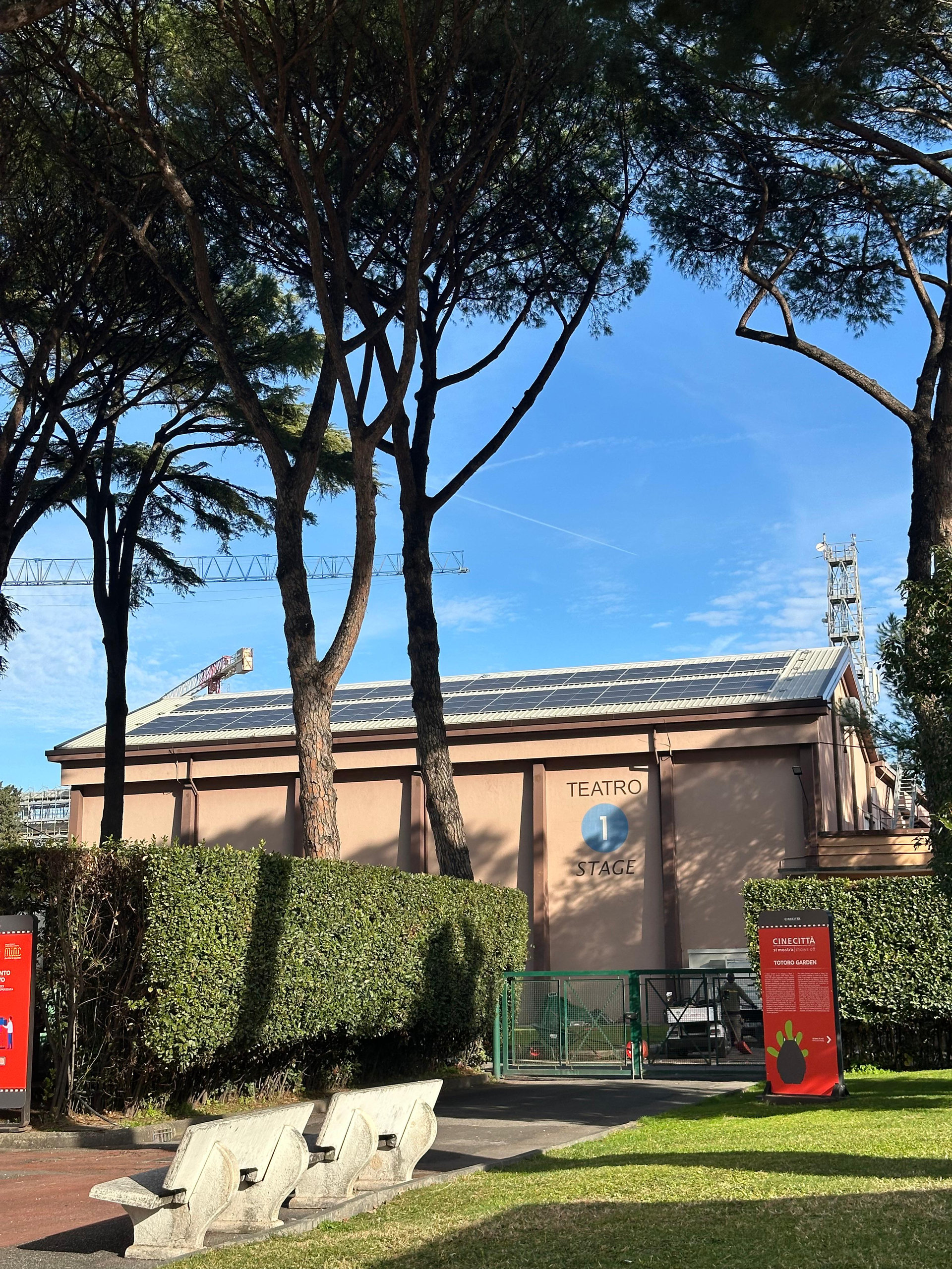 A Cinecittà sound stage seen from the pine-lined avenue of the studios