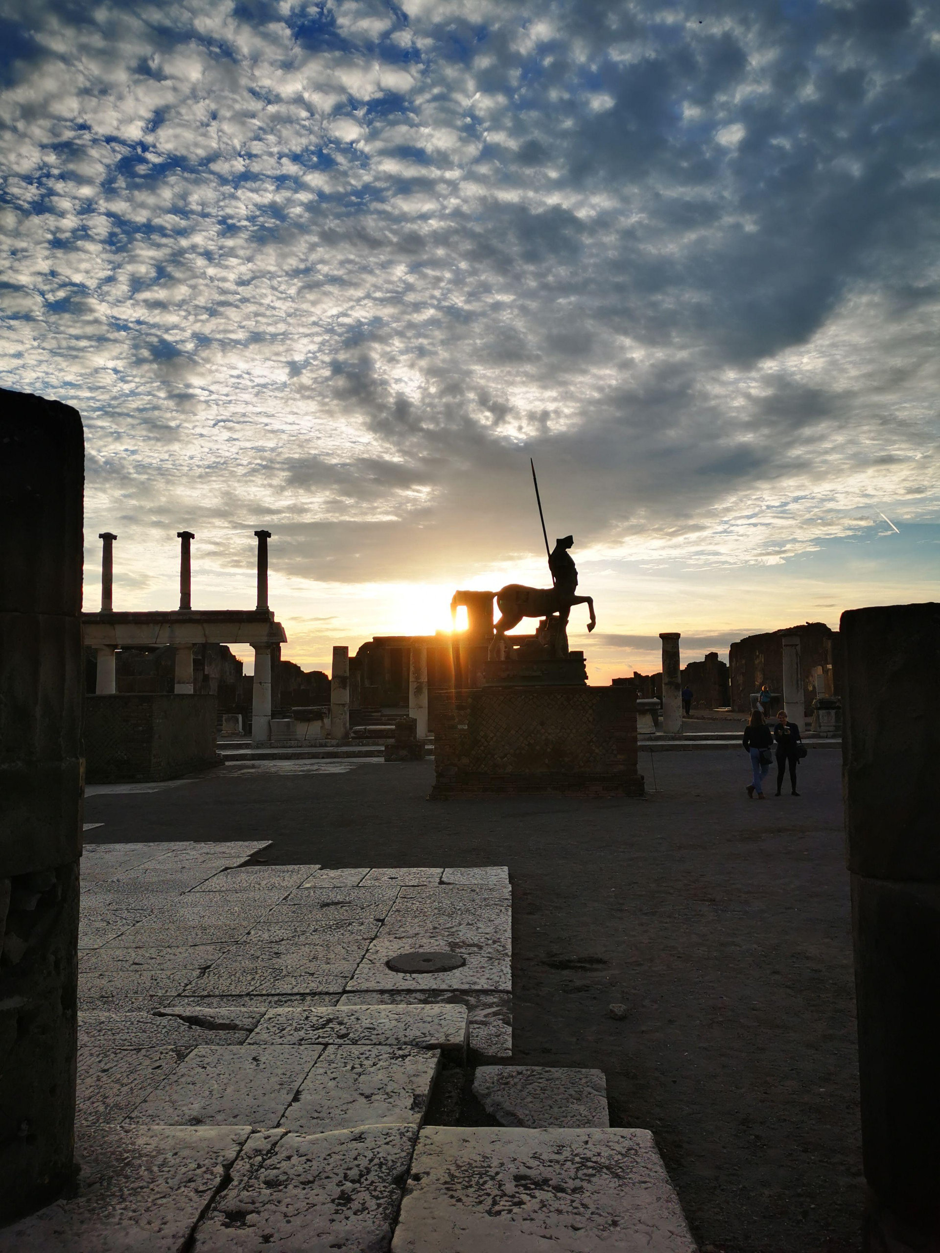 The colonnade of the Pompeii forum at sunrise