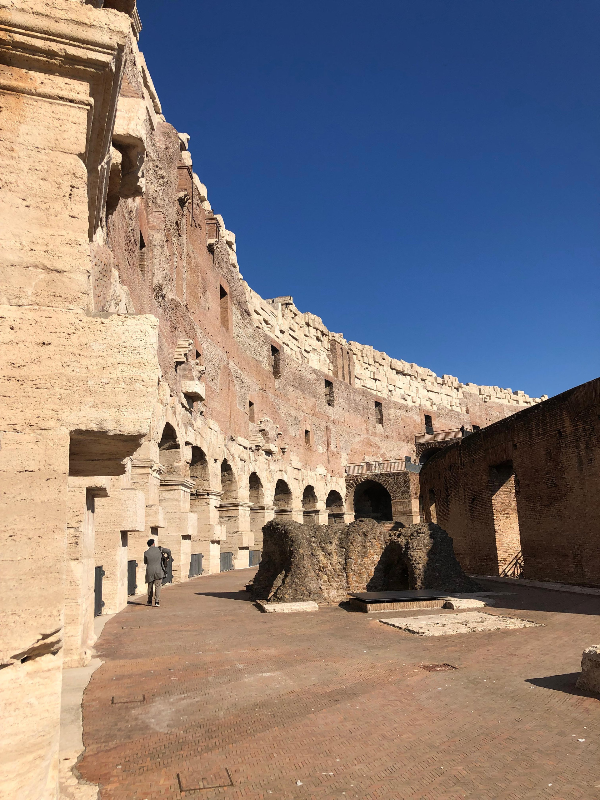 The tiered brick and concrete interior of the Colosseum