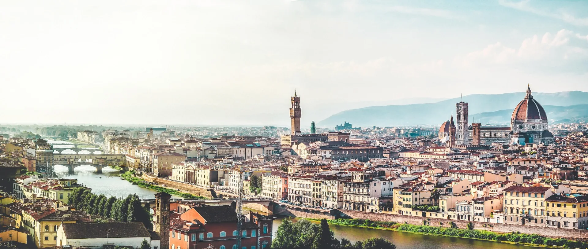 Panoramic view of Florence with its bridges, Palazzo Vecchio tower and the cathedral dome