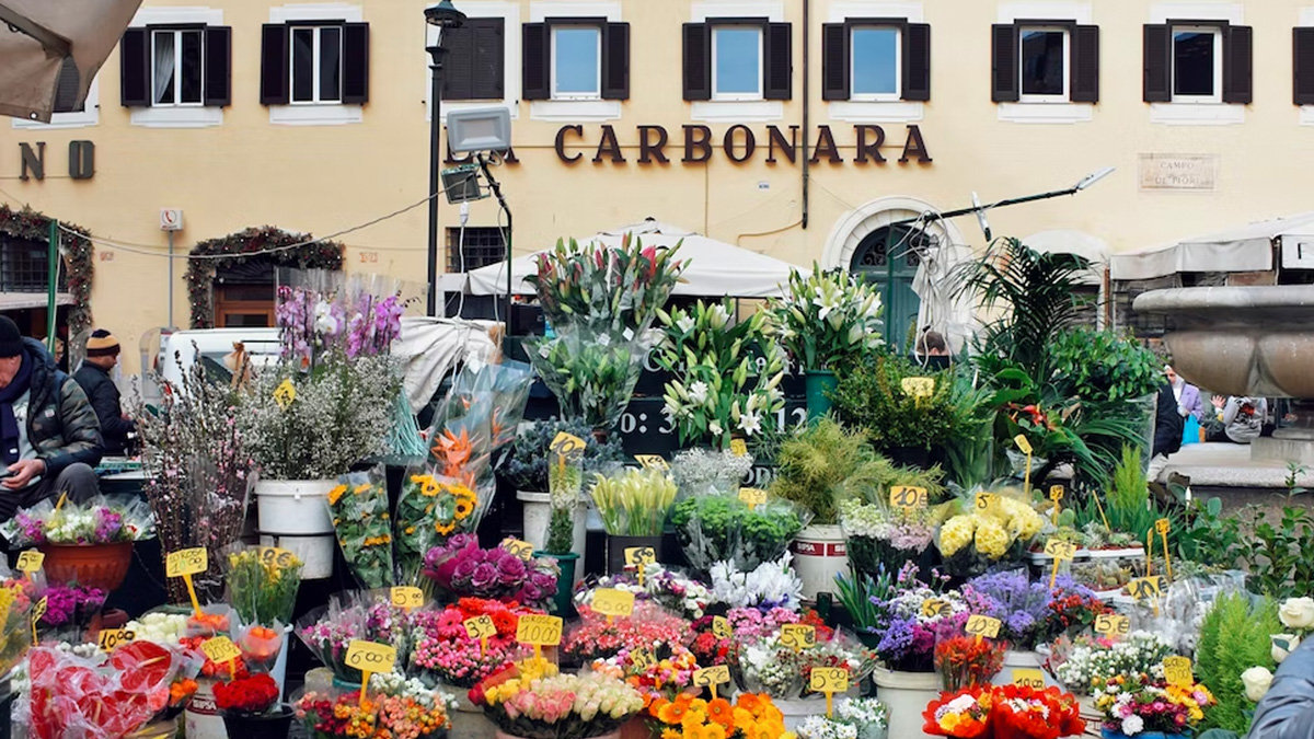 Flower stalls of colourful bouquets in Campo de' Fiori market square