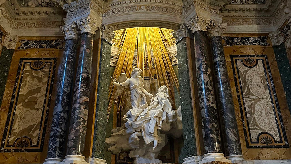 Bernini's Ecstasy of Saint Teresa, a marble sculpture of an angel and saint beneath golden rays
