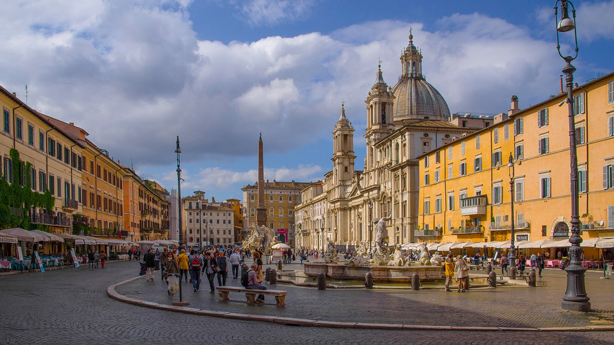 Piazza Navona with the Four Rivers Fountain, the obelisk and the Baroque church facade