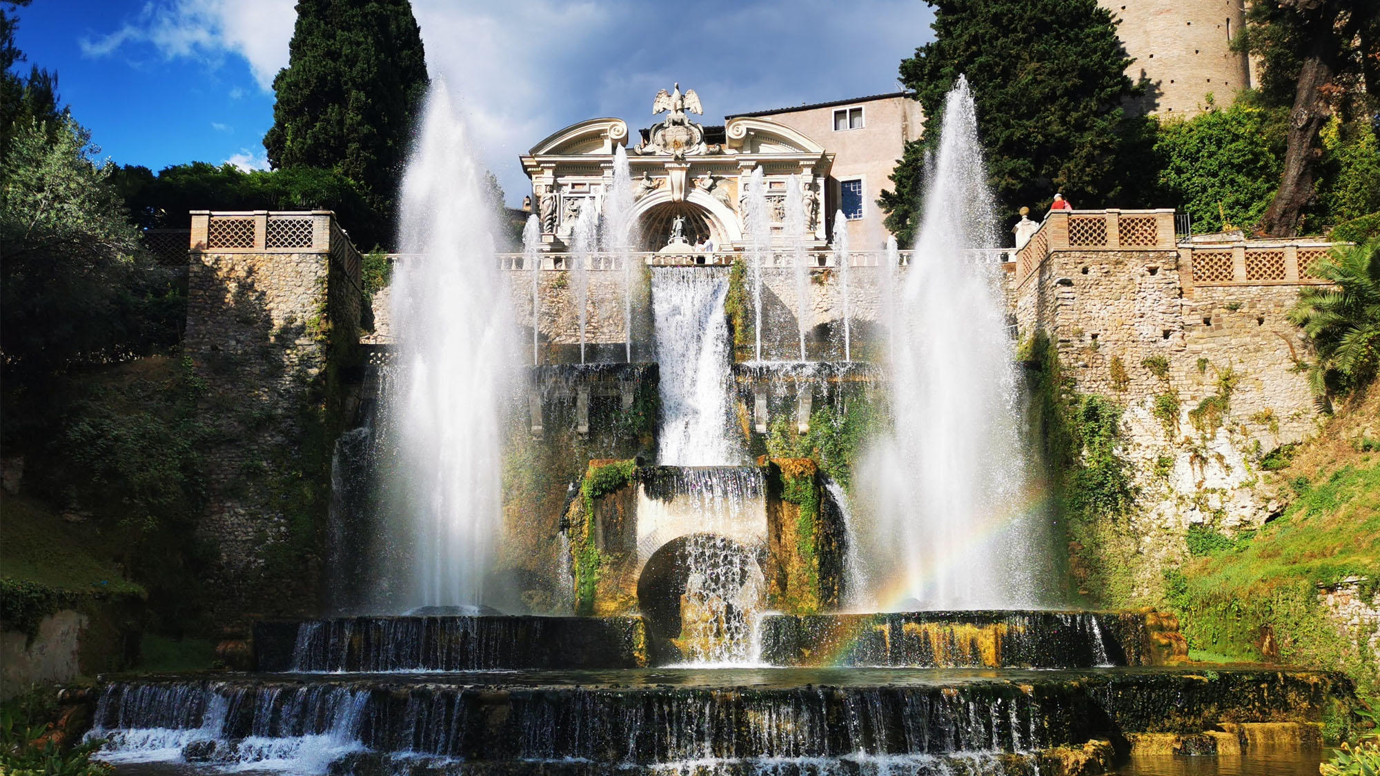 Tiered fountains cascading in front of a Renaissance palace at Villa d'Este in Tivoli