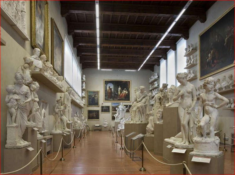 Hall of plaster casts and sculptures at the Accademia Gallery with a timber ceiling