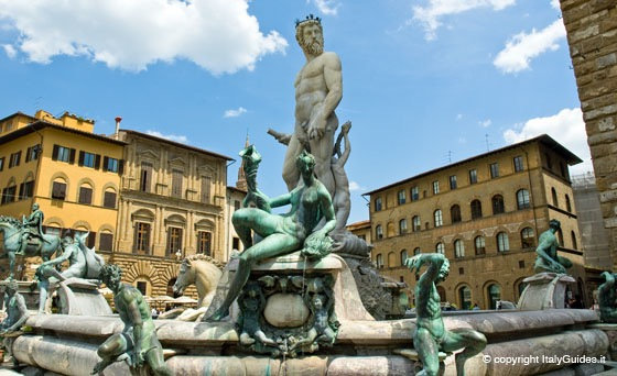 Neptune Fountain in Piazza della Signoria with bronze satyrs and sea creatures beside Florentine palaces