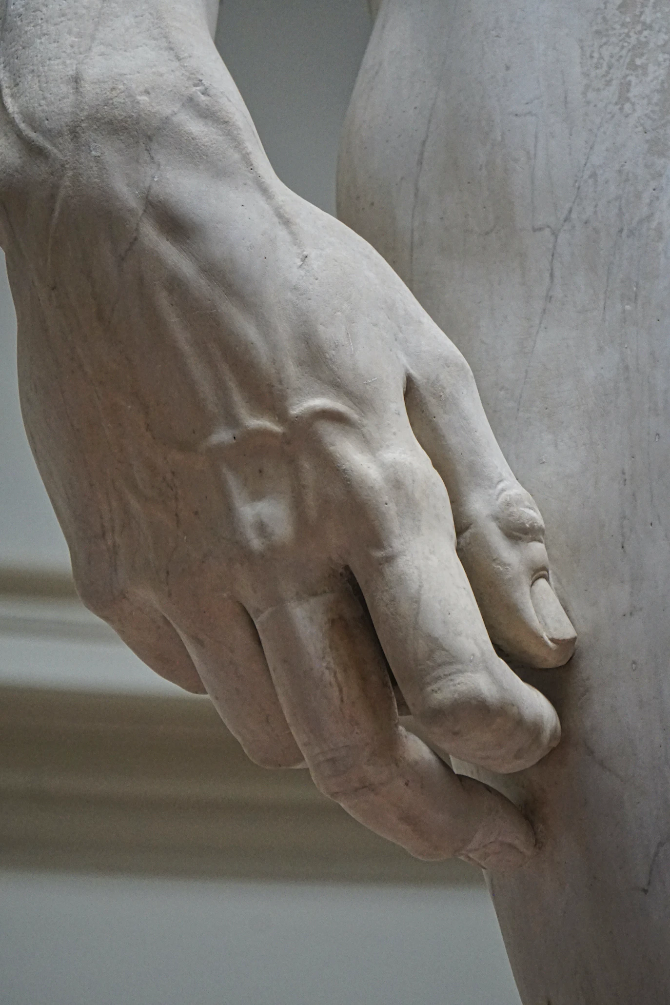 Close-up of the marble hand of Michelangelo's David with carved veins