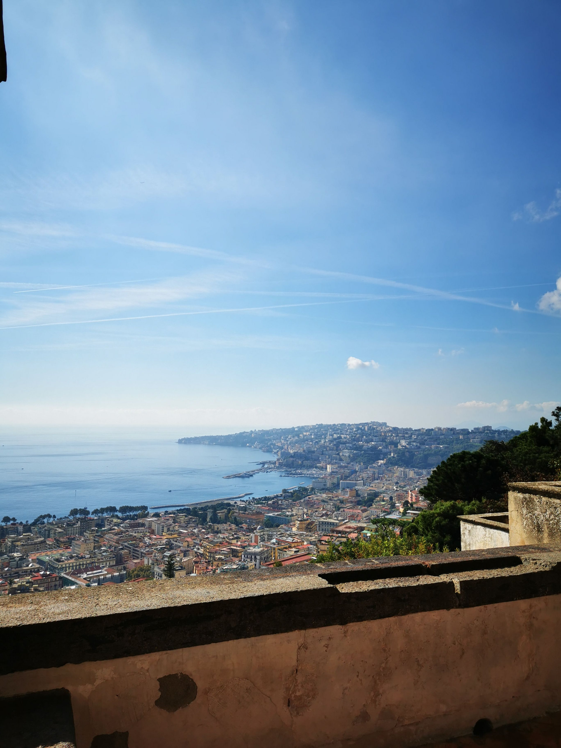 View over the Bay of Naples and the coastline from a terrace wall