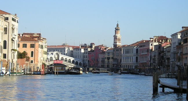 View along the Grand Canal towards the Rialto Bridge in warm afternoon light