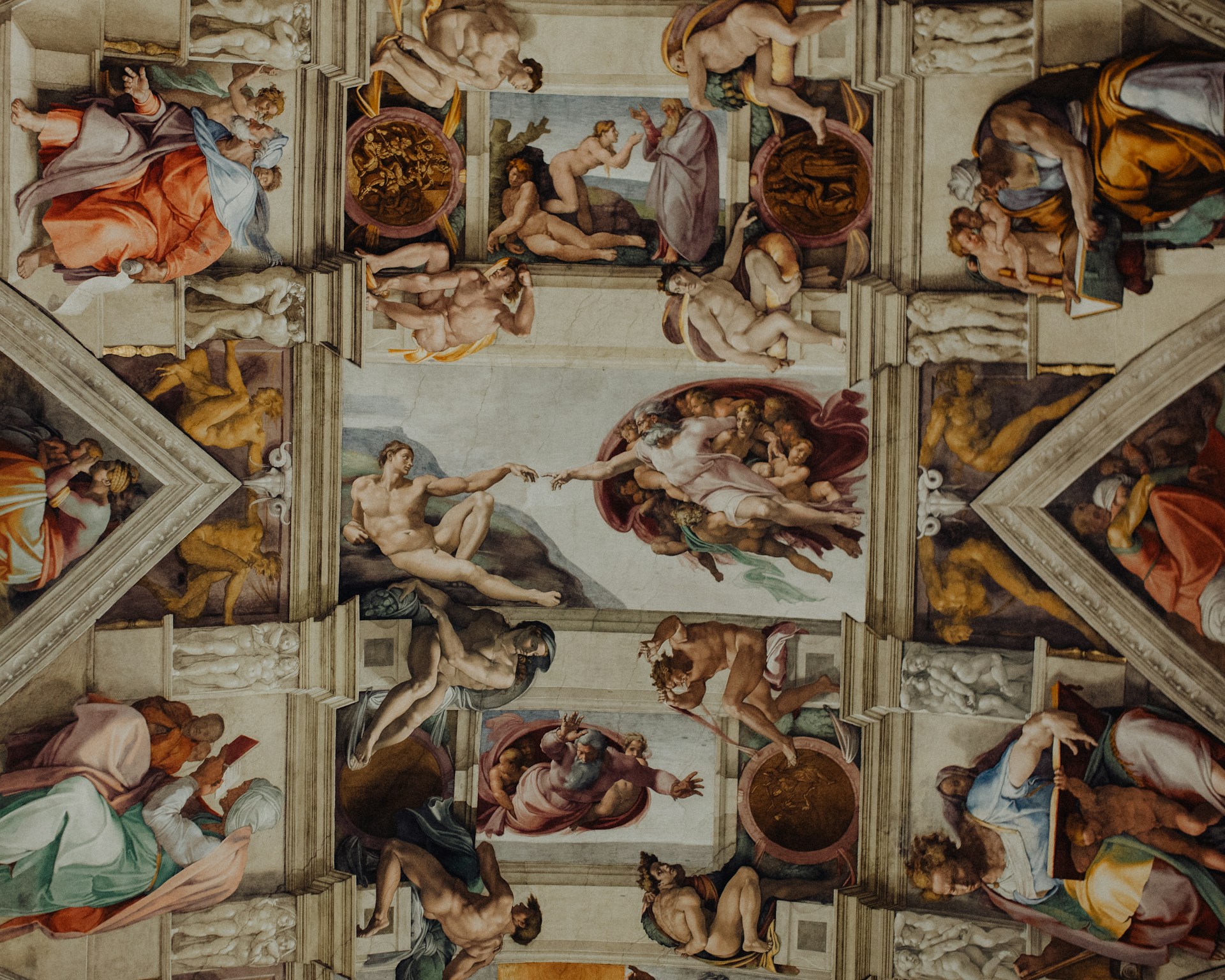 Frescoed ceiling of the Sistine Chapel with Michelangelo's Creation of Adam at the centre