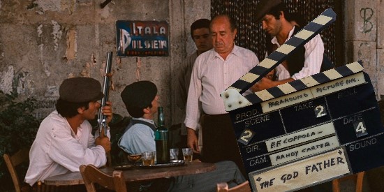 Film still from The Godfather with men at a cafe table, overlaid by a clapperboard