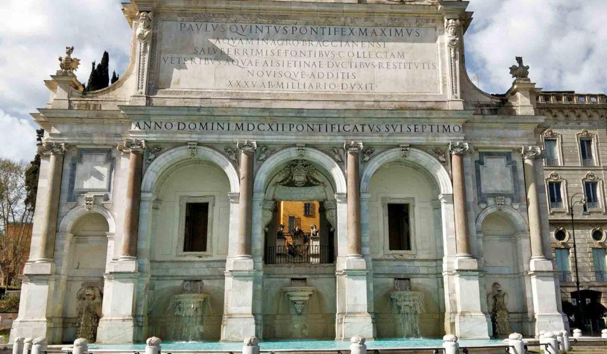 Triple-arched Baroque fountain with a long Latin inscription, on the Janiculum Hill in Rome