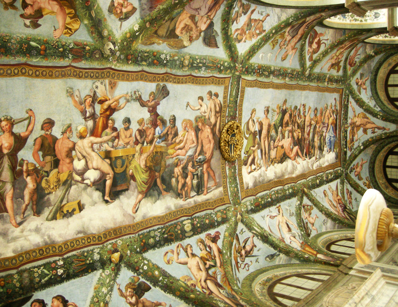 Angled view of the loggia vault, with mythological frescoes between garlands and decorative panels