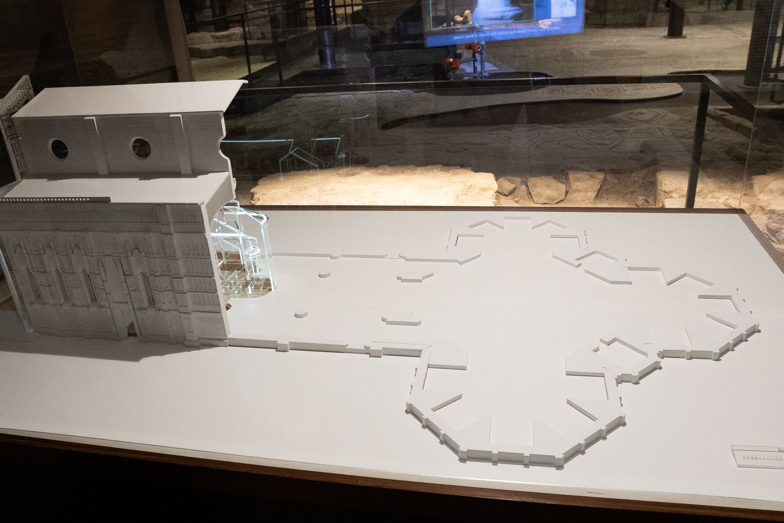 White scale model of the ancient church foundations displayed above excavated remains