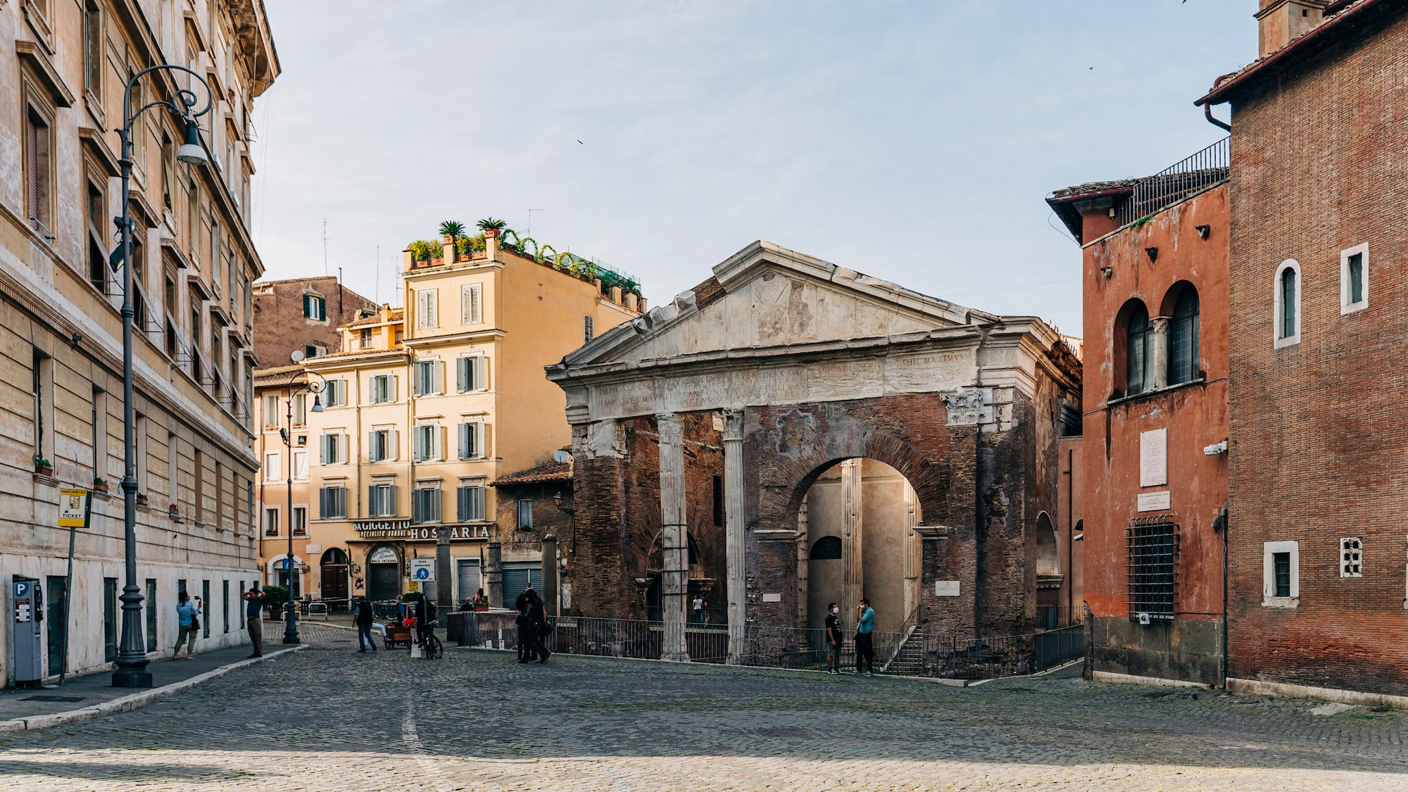 Ancient columned portico of Octavia's Portico amid buildings in Rome's Jewish Ghetto