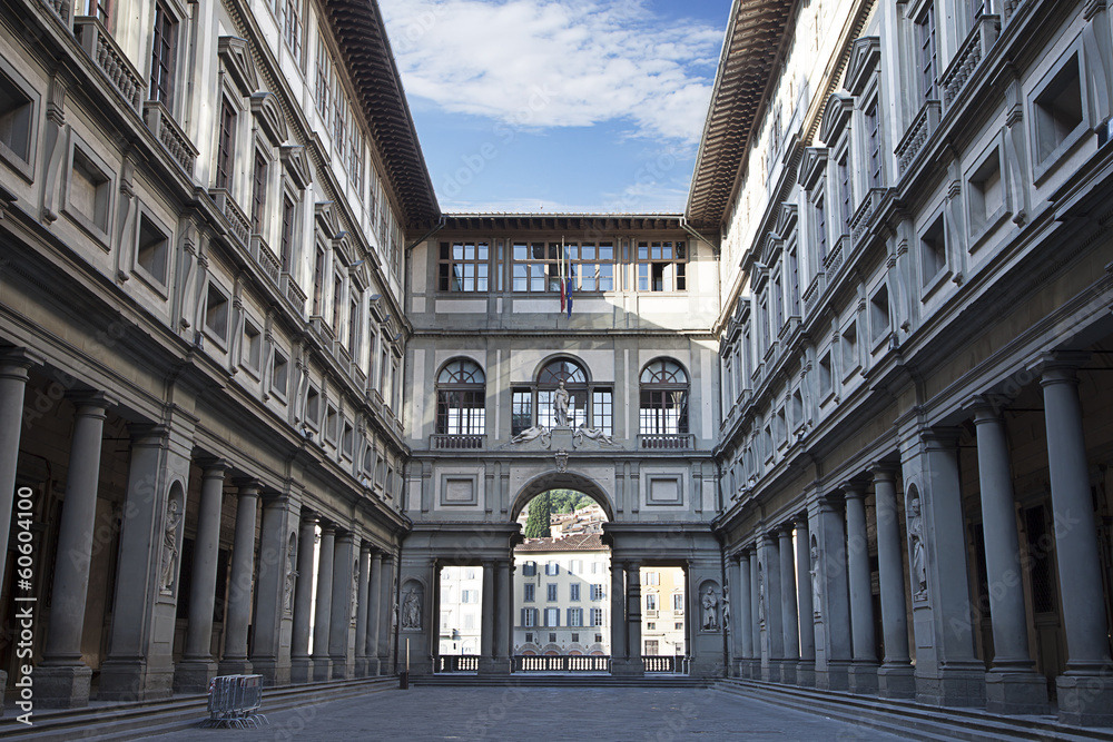 Uffizi Gallery's U-shaped courtyard with colonnades opening onto the Arno