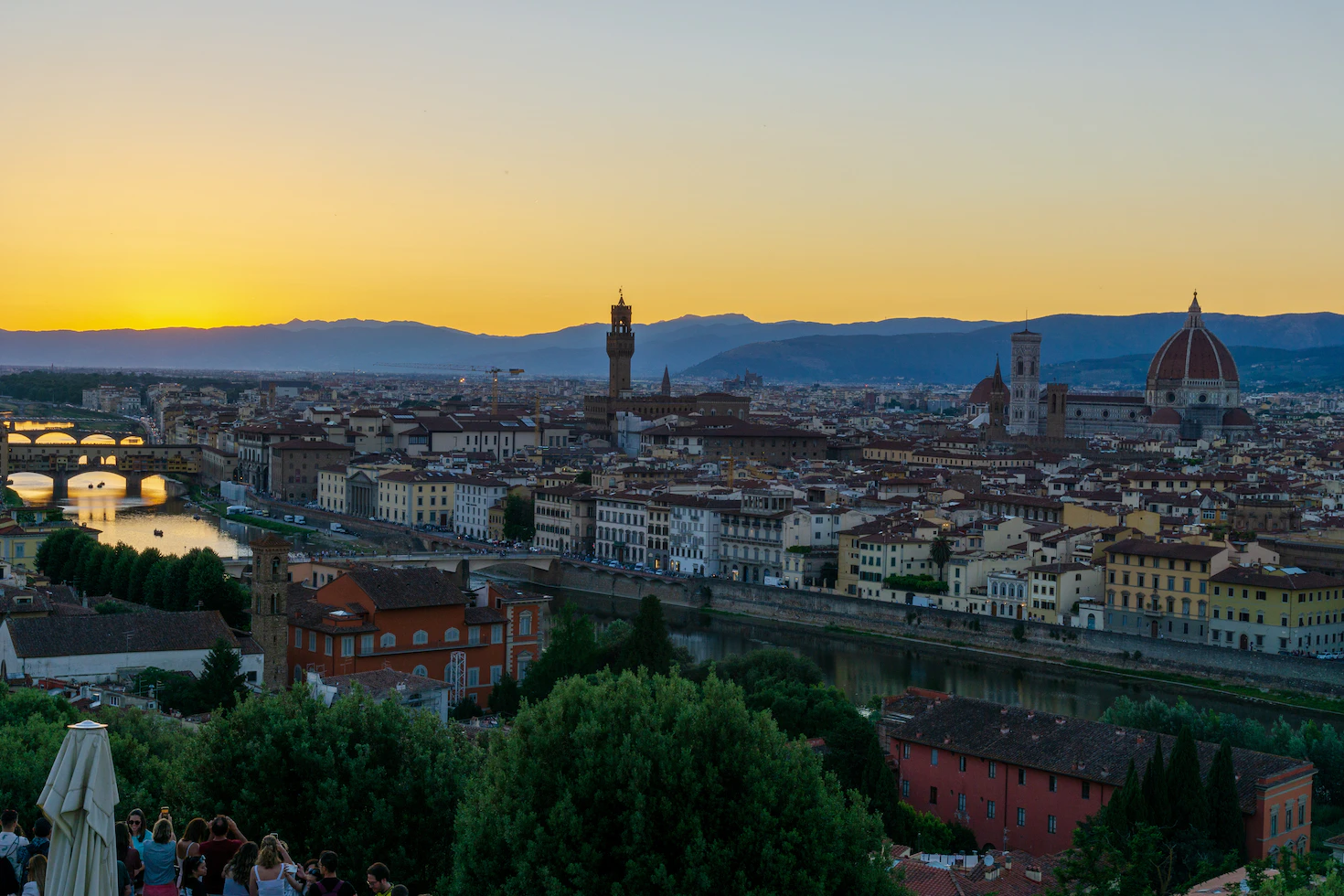 Panorama of Florence at sunset with the Arno, Ponte Vecchio, the Duomo and Palazzo Vecchio tower